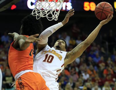 Iowa State forward Darrell Bowie (10) shoots while guarded by Oklahoma State guard Davon Dillard (24) during second half of an NCAA college basketball game in the quarterfinal round of the Big 12 tournament in Kansas City, Mo., Thursday, March 9, 2017. Iowa State defeated Oklahoma State 92-83. (Orlin Wagner / Associated Press)