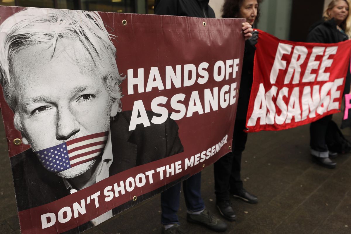 Demonstrators hold banners outside Westminster Magistrates Court in London, Wednesday, Feb. 19, 2020. A case-management hearing regarding Julian Assange will be heard at the court Wednesday. It comes just five days before the extradition hearing beginning Feb. 24, at Woolwich Crown Court, in which both Julian Assange and the broader issues of press freedom will be at stake. (Kirsty Wigglesworth / AP)