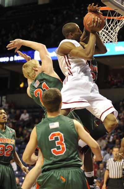 WSU’s Marcus Capers, beating Texas-Pan American defenders to the basket during last weekend’s game at the Arena, is known for exciting the crowd with thunderous dunks.  (Colin Mulvany)