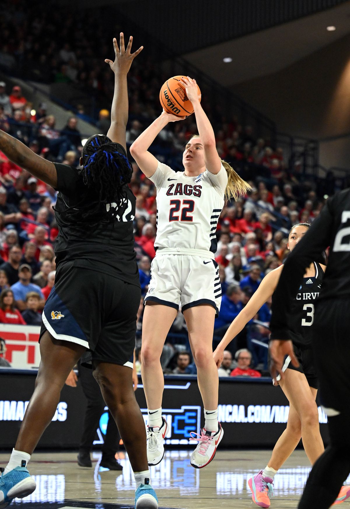 Gonzaga guard Brynna Maxwell (22) shoots the ball over UC Irvine center Nevaeh Parkinson (32) during the first half of a NCAA Division 1 first round college basketball tournament game, Sat., March 23, 2024, in the McCarthey Athletic Center.  (COLIN MULVANY)