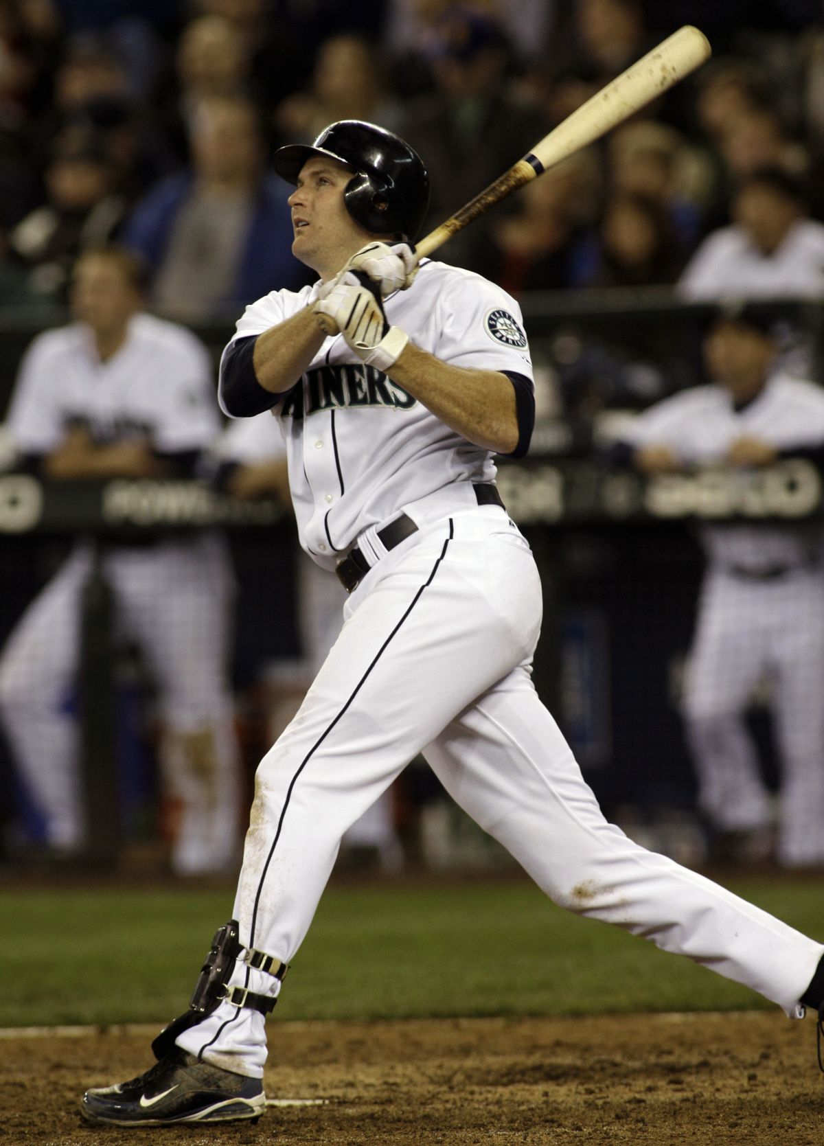M’s Mike Sweeney takes a look at his two-run home in the eighth inning.  (Associated Press)
