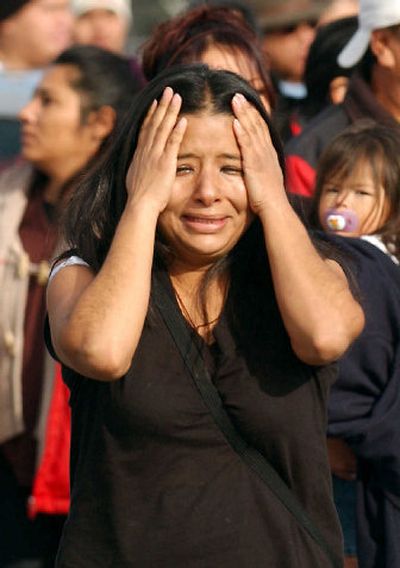 
Lisa Gallegos, of Greeley, cries during a raid of the Swift and Company Beef Plant in Greeley, Colo., on Tuesday. 
 (Longmont (Colo.) Daily Times-Call / The Spokesman-Review)