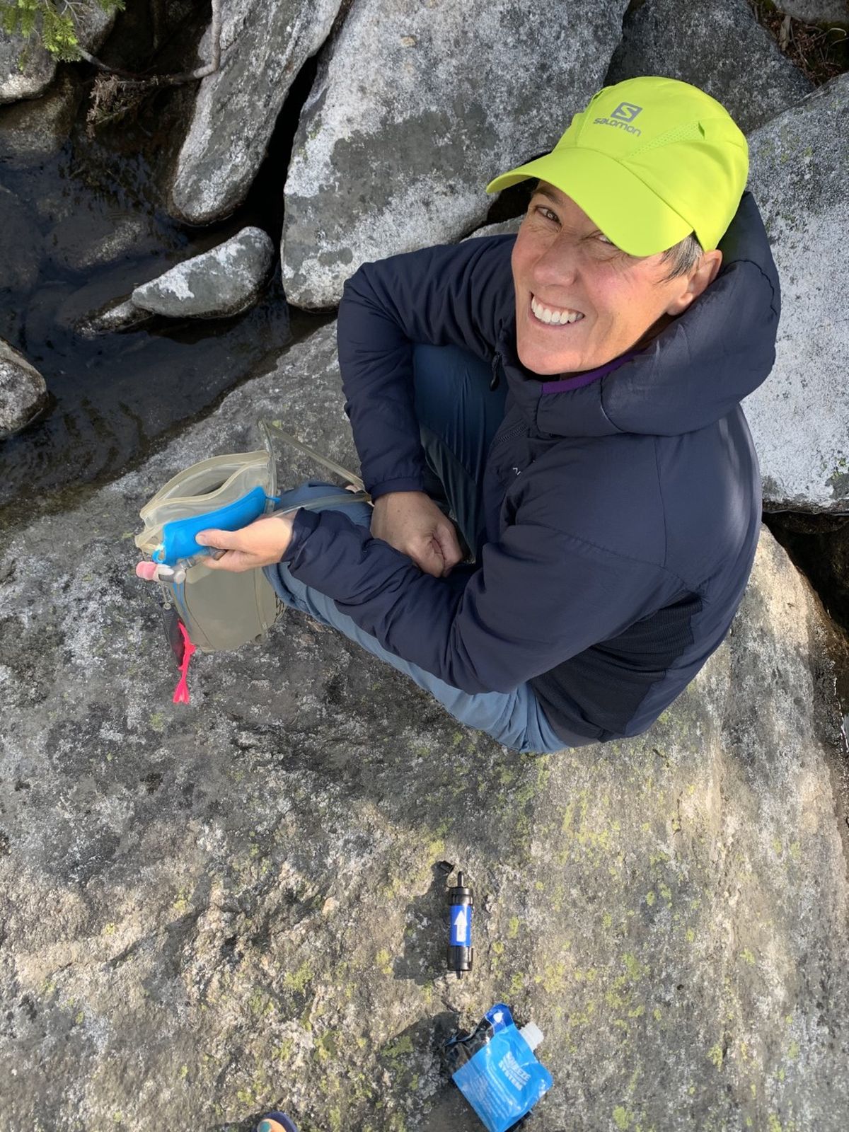 Shannon Barnes goes about the rewarding daily chore of filtering water from an alpine lake.  (Ammi Midstokke/courtesy)