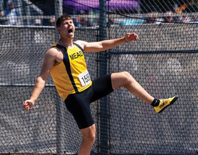 Mead’s Simon Rosselli lets out a roar after his final attempt in the 4A boys discus at the WIAA State Track and Field Championships at Mount Tahoma High School in Tacoma.  (Spokesman-Review Photo Archives)
