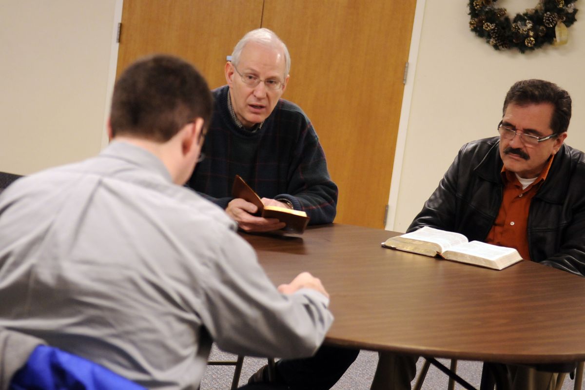  The Rev. Eric Walsh, center, of Greenacres Baptist Church, leads a Bible study with pastors Harry Velez, left, of College Avenue Baptist Church in St. Maries, and Sergio Rivera,  of First Baptist Church of Kellogg, on Monday morning.  (J. BART RAYNIAK)