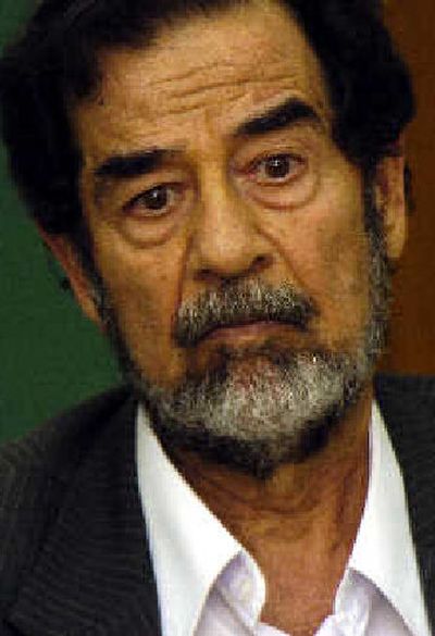 
 Former Iraqi dictator Saddam Hussein is being questioned by magistrates in this photo released Monday. 
 (Associated Press / The Spokesman-Review)