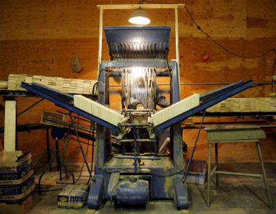 
Dave Johnson uses a nailing machine to put together gift boxes recently at his shop in Wenatchee.  He is planning to retire soon and is looking for a buyer for his business.
 (Associated Press photos / The Spokesman-Review)