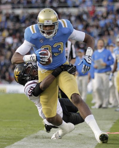 UCLA wide receiver Nelson Rosario (83) and his teammates have a chance to stun the college football world tonight. (Associated Press)