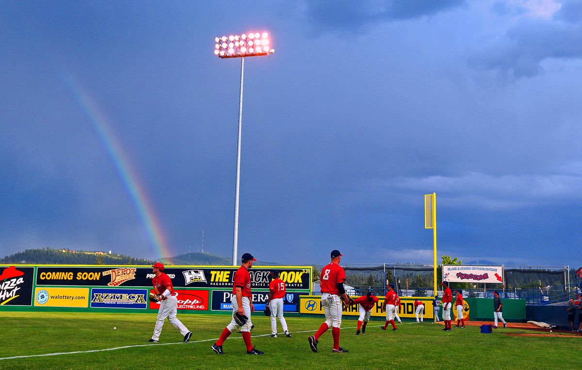 The Spokane Indians gathered for their first practice at Avista Stadium on Wednesday, only to be greeted by threatening skies and rain showers. (CHRISTOPHER ANDERSON / The Spokesman-Review)