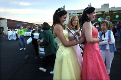 
Before the start of last year's Valleyfest Parade, Spokane Valley Ambassador Laura Schlect, right,  gets help with her dress from fellow ambassador Amanda Hansen and Miss Spokane Valley Carly Jordan. 
 (Holly Pickett / The Spokesman-Review)