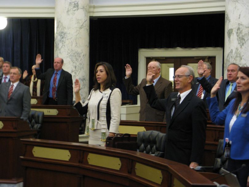 Idaho House members, including Rep. Paulette Jordan, D-Plummer, center, take the oath of office on Thursday. Jordan is the third Coeur d'Alene tribal member to serve in the Legislature in Idaho's history. (Betsy Russell)