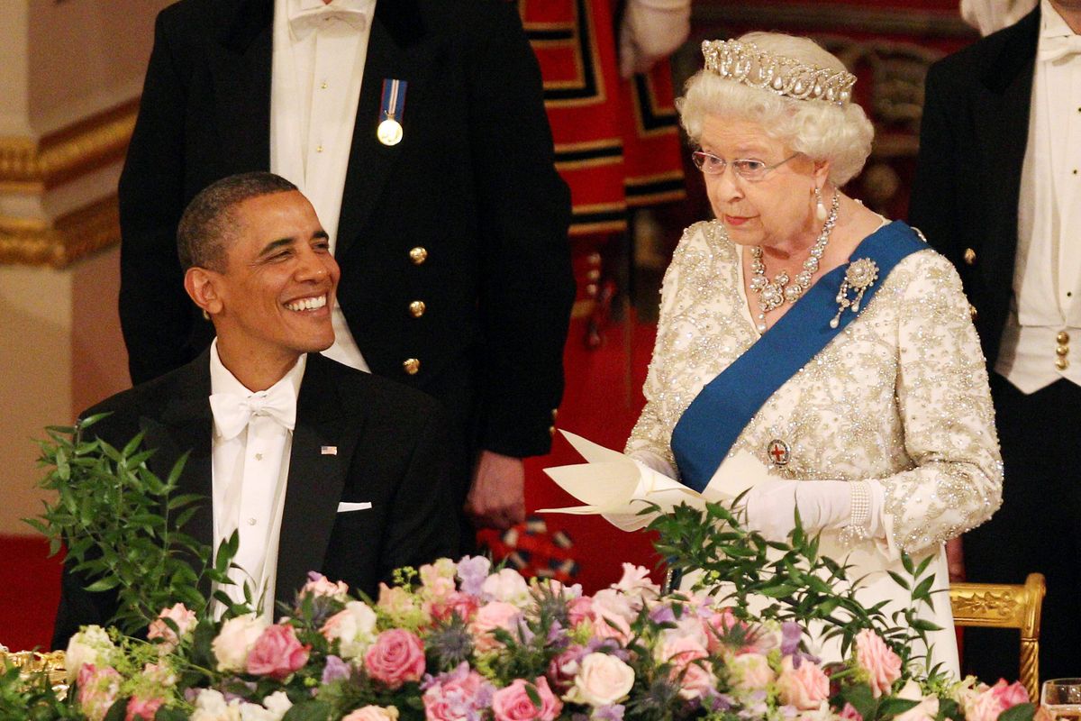 Queen Elizabeth II makes a speech as U.S. President Barack Obama reacts Tuesday at Buckingham Palace. (Associated Press)