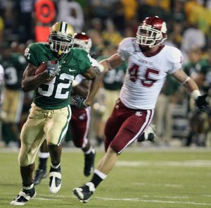 Baylor running back Jay Finley breaks away from WSU’s Andy Mattingly for a 46-yard touchdown run. (Associated Press / The Spokesman-Review)