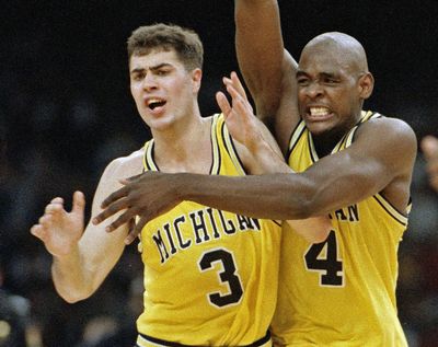 In this April 3, 1993 file photo, Michigan's Chris Webber (4) and Rob Pelinka (3) celebrate in New Orleans as they defeated Kentucky 81-78 in overtime to advance to the NCAA college basketball championship game against North Carolina. Longtime sports agent Rob Pelinka, whose clients included Kobe Bryant, was formally named the Los Angeles Lakers' new general manager Tuesday, March 7, 2017. (Ed Reinke / Associated Press)