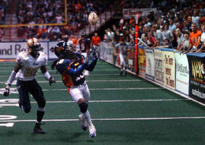 
The Shock's Charles Frederick completes a pass for a touchdown late in the first half against Quad City Saturday. 
 (Jed Conklin / The Spokesman-Review)