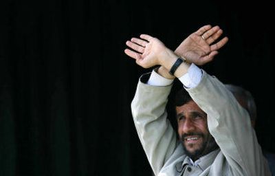 
Iranian President Mahmoud Ahmadinejad waves to his supporters in Gonabad, northeast of Tehran, on Thursday. Ahmadinejad says the world must begin treating Iran as a nuclear power. 
 (Associated Press / The Spokesman-Review)