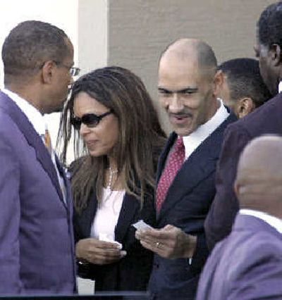 
Tony Dungy, third from left, and his wife, Lauren, after the funeral for their son, James.
 (Associated Press / The Spokesman-Review)