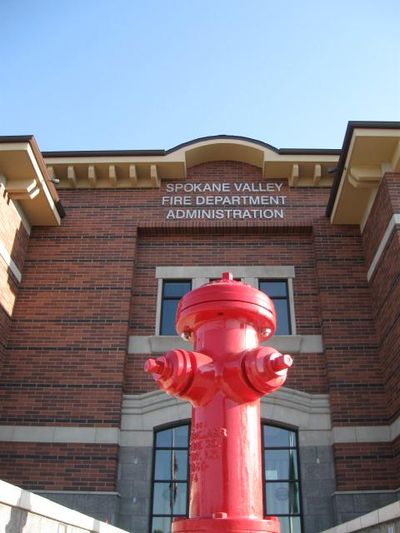 A red fire hydrant is shown in front of the Spokane Valley Fire Department Administration building. (Spokane Valley Fire Department)