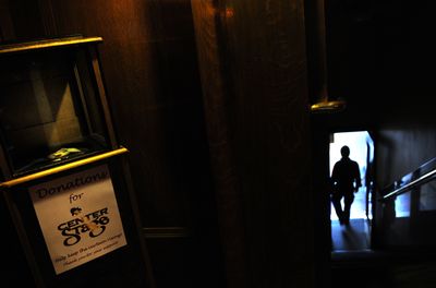 A donation box holds a few dollars at Center Stage in downtown Spokane on Tuesday.  (PHOTOS BY RAJAH BOSE / The Spokesman-Review)