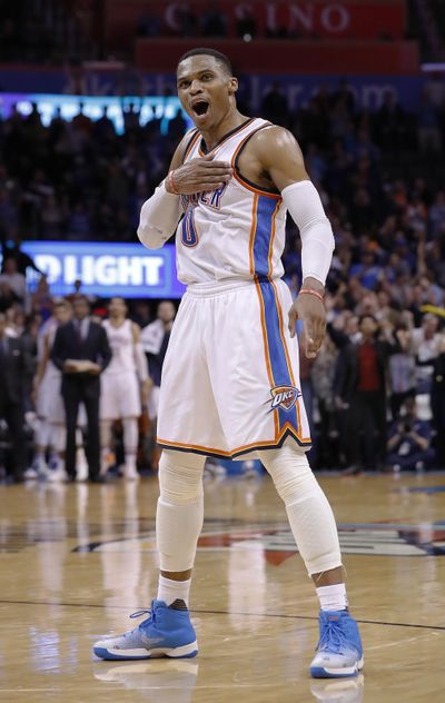 Oklahoma City Thunder guard Russell Westbrook (0) reacts after shooting a 3-pointer against the Washington Wizards during the second half of an NBA basketball game in Oklahoma City, Wednesday, Nov. 30, 2016. Oklahoma City won in overtime, 126-115. (Alonzo Adams / Associated Press)