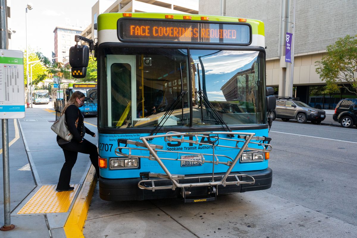 A passenger boards a Spokane Transit Authority bus in August 2020 at the STA Plaza in downtown Spokane.  (Colin Mulvany/THE SPOKESMAN-REVIEW)