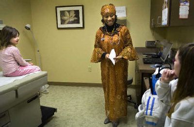 
Dr. Jane-Frances Akpamgbo, originally from Nigeria, talks to Rebecca Mitchell, right, and her six-year-old daughter Hayleigh Middleton during a visit to J.A. Medical Center, a new family practice, urgent care and women's health clinic opened by Akpamgbo in Medical Lake. 
 (Holly Pickett / The Spokesman-Review)