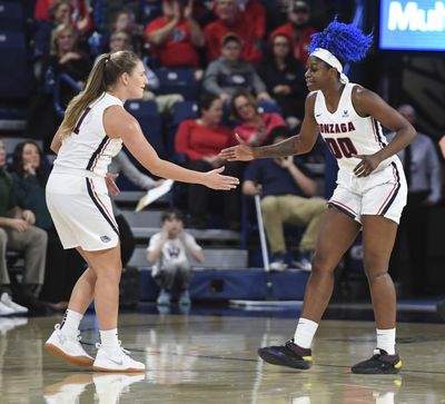 Gonzaga guard Laura Stockton, left, congratulates teammate Zykera Rice during the Nov. 28  game against Colorado State. (Dan Pelle / The Spokesman-Review)