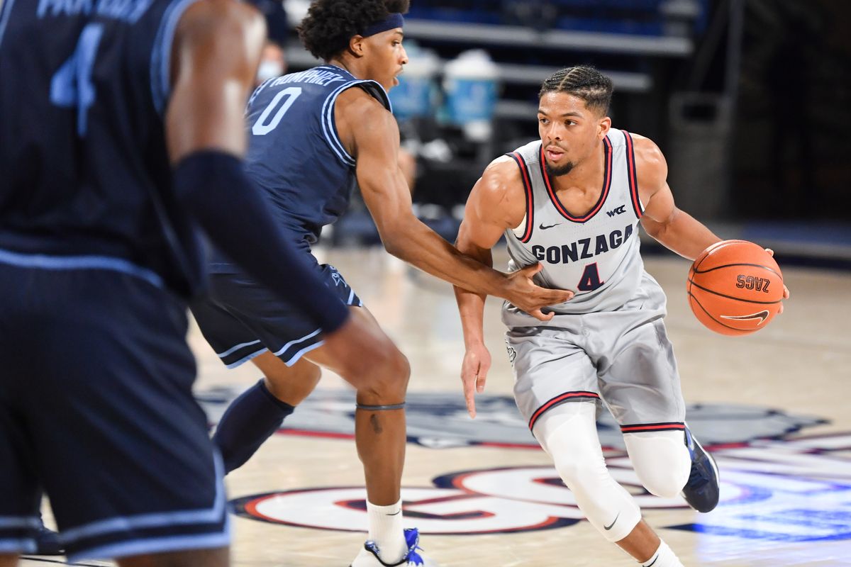 Gonzaga Bulldogs guard Aaron Cook (4) drives the ball during the second half of a college basketball game on Saturday, February 20, 2021, at McCarthey Athletic Center in Spokane, Wash. Gonzaga won the game 106-69.  (Tyler Tjomsland/THE SPOKESMAN-RE)
