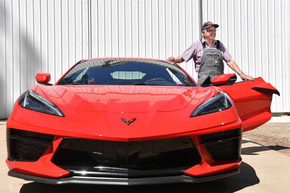 Vern Eden, 87, stands for a photograph with his brand new 2021 C8 Corvette on Thursday at his home in Valleyford. For various reasons, Eden had to wait 18 months until his dream ride was available for picking up.  (Tyler Tjomsland/The Spokesman-Review)