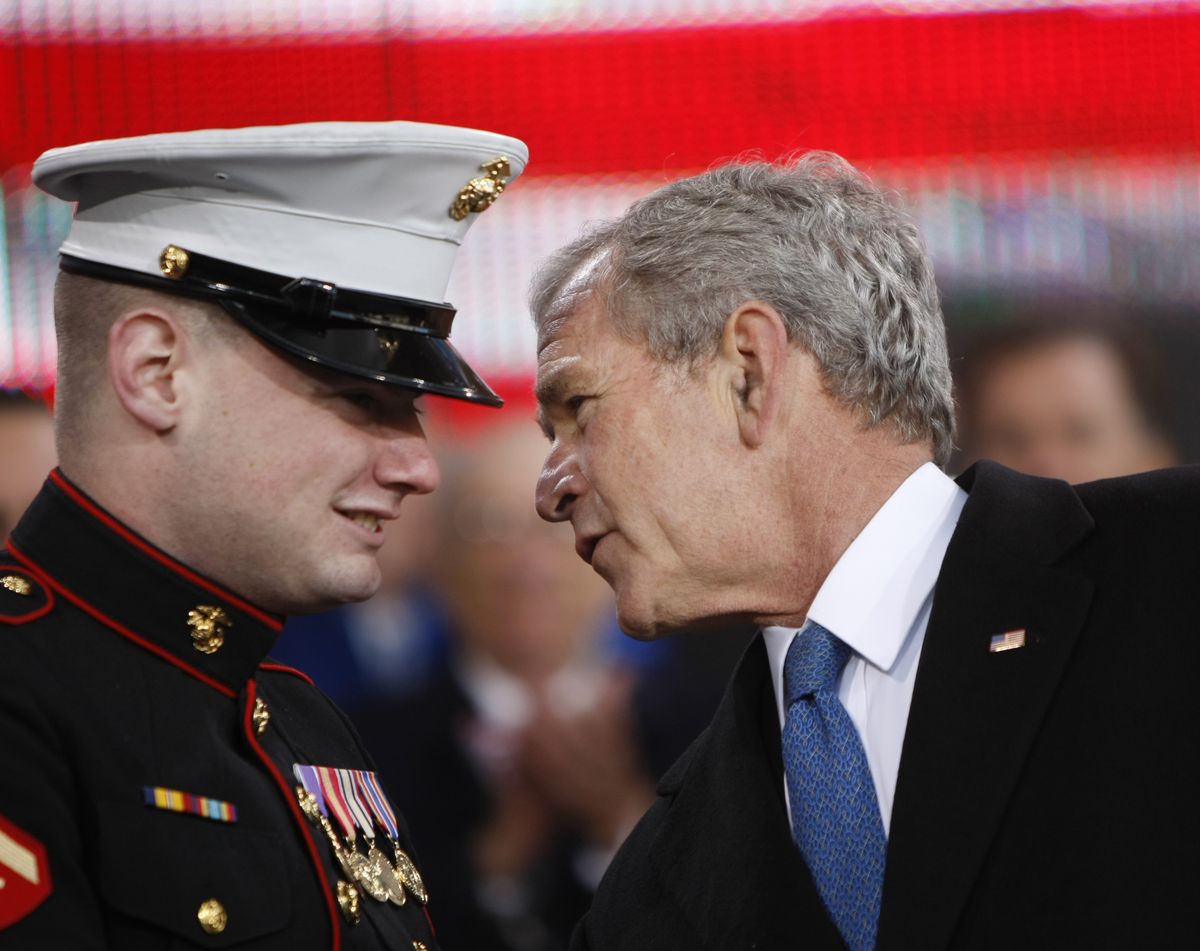 President Bush talks with wounded Marine Lance Cpl.  Matt Bradford on Tuesday. (Gerald Herbert / The Spokesman-Review)