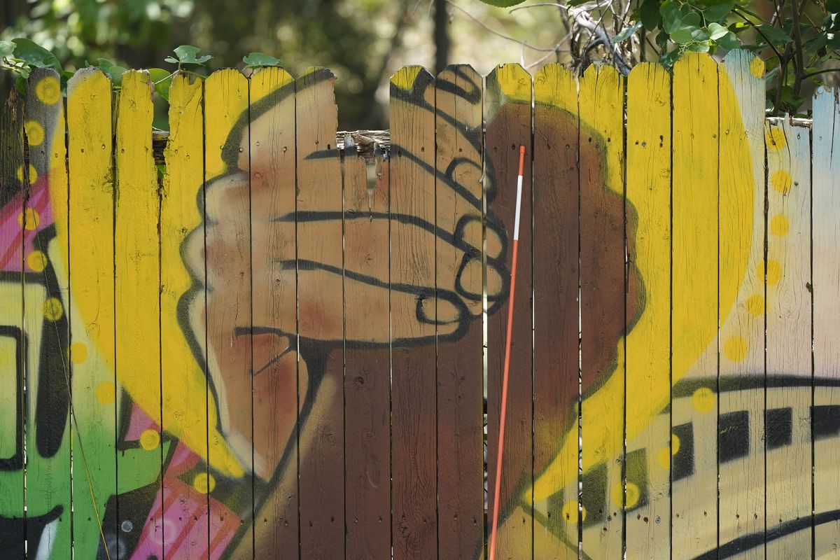 A mural on a fence is displayed at United Fort Worth, a grassroots community organization in Fort Worth, Texas, Tuesday, Aug. 10, 2021. The Census Bureau is due to release new data on the nation's changing population. The numbers scheduled to come out Thursday, Aug. 12 will show that dozens of counties across 18 states no longer have a majority racial or ethnic group..  (LM Otero)
