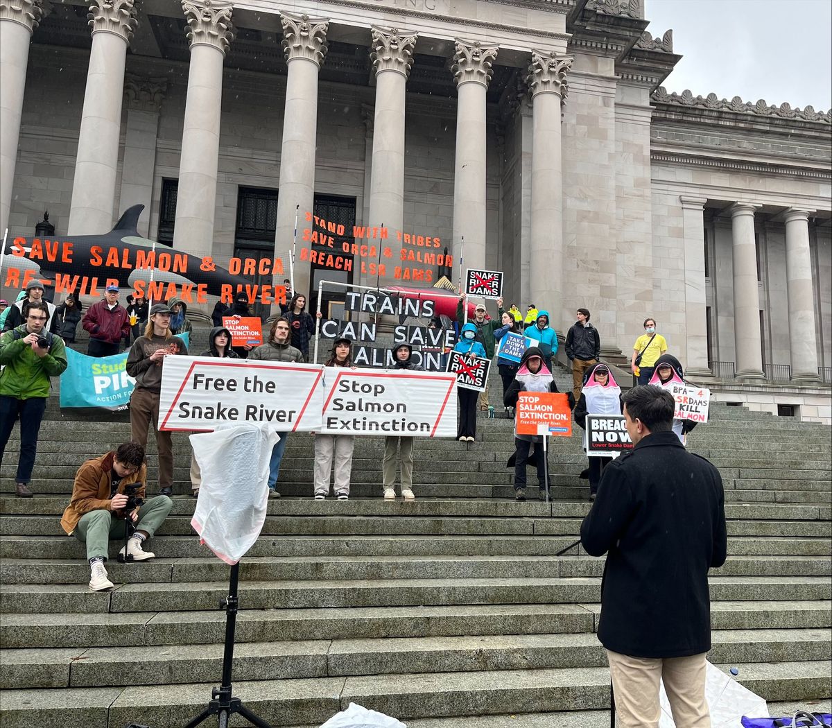 Rep. Alex Ramel, D-Bellingham, addresses the crowd of demonstrators on the steps of the Capitol building.  (Elena Perry / The Spokesman-Review)