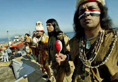 
Matthew Lovio, right, and Andy Guiding Young Cloud, second from right, along with other Tongva dancers, watch as two trailers containing about 100 buffalo are moved onto a barge on the Catalina Island in Avalon, Calif.Matthew Lovio, right, and Andy Guiding Young Cloud, second from right, along with other Tongva dancers, watch as two trailers containing about 100 buffalo are moved onto a barge on the Catalina Island in Avalon, Calif.
 (Associated PressAssociated Press / The Spokesman-Review)