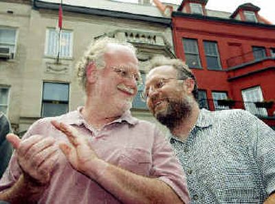 
The founders of Ben & Jerry's Ice Cream, Ben Cohen, left, and Jerry Greenfield, protest in front of Sudan's embassy Thursday in Washington. Cohen and Greenfield were later arrested on the steps of the embassy.
 (Associated Press / The Spokesman-Review)