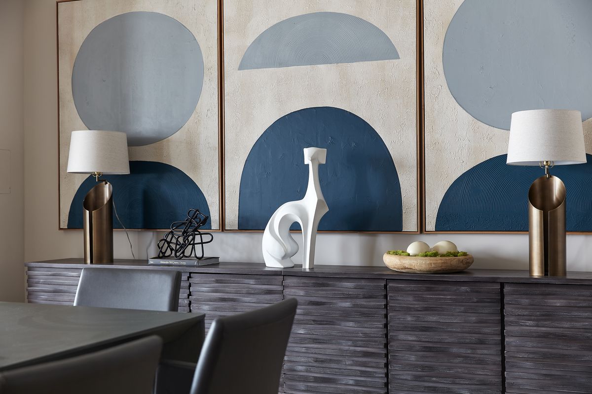 A long, expansive case good (sideboard) is adorned with three vignettes to help add interest and color.  (Scott Gabriel Morris/Tribune News Service)