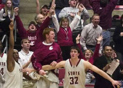 
Washington State University fans and players celebrate after Chris Schlatter hit a 3-pointer to give the Cougars a lead with 9 seconds remaining on Saturday. 
 (Kevin Nibur/ / The Spokesman-Review)