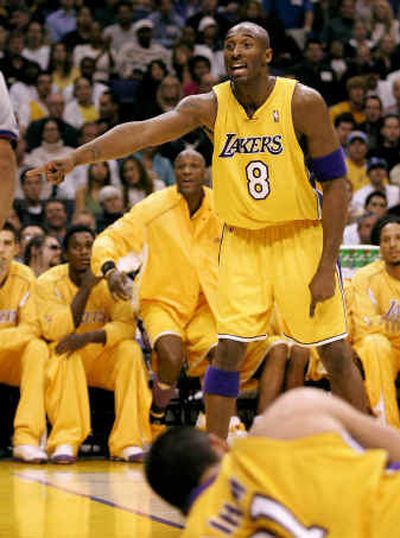 
Lakers guard Kobe Bryant (8) lobbies for a call during Los Angeles' win over Denver. Bryant finished with 25 points, seven assists and three blocks.
 (Associated Press / The Spokesman-Review)