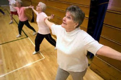 
Patricia Stone, far right, warms up during her hour-long cardio-rehabilitation class for seniors held at the YMCA Wednesday. Exercise for people over age 50 can help them physically as well as emotionally. 
 (Colin Mulvany / The Spokesman-Review)