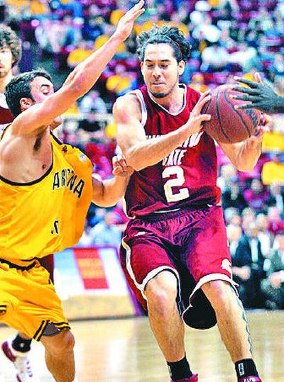 
WSU's Derrick Low drives the lane on ASU's Derek Glasser.
 (Associated Press / The Spokesman-Review)