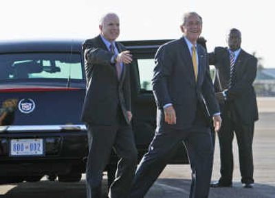 
President Bush is accompanied by  Sen. John McCain, R-Ariz., at Phoenix Sky Harbor International Airport after Bush attended a fundraising event for McCain  on Tuesday. Associated Press
 (Associated Press / The Spokesman-Review)