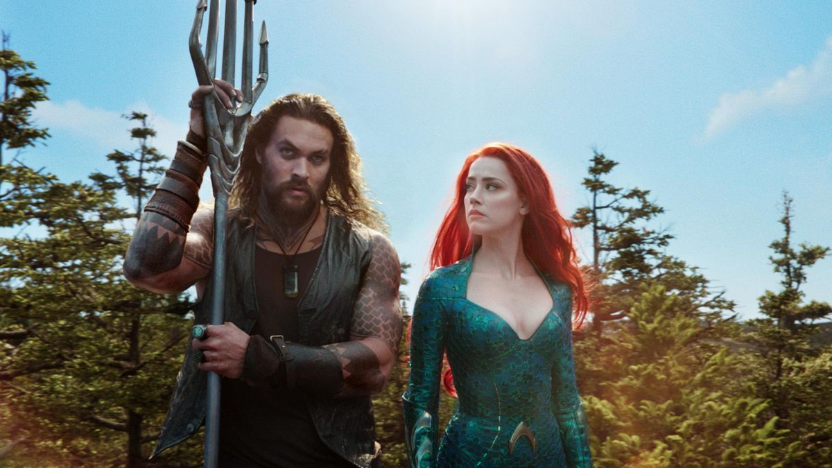 Jason Momoa, left, and Amber Heard in a scene from “Aquaman.” (Warner Bros. Pictures)
