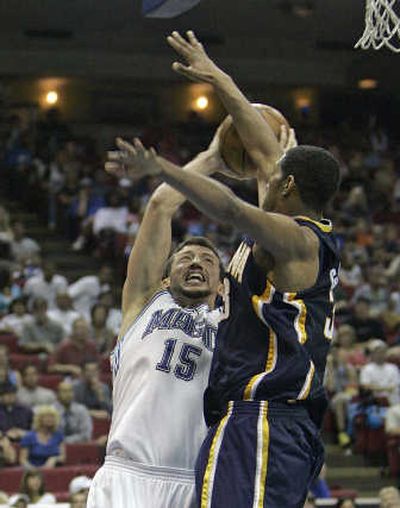 
Orlando Magic forward Hedo Turkoglu attempts to get off a shot over Indiana Pacers forward Danny Granger. Associated Press
 (Associated Press / The Spokesman-Review)