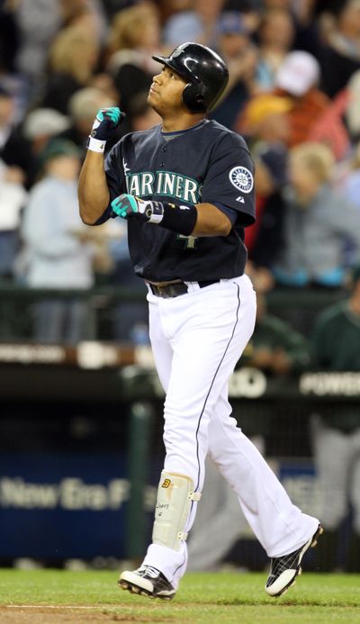 Two home runs by Jose Lopez were a big part of Seattle’s 10-8 win over Oakland.  (Associated Press / The Spokesman-Review)