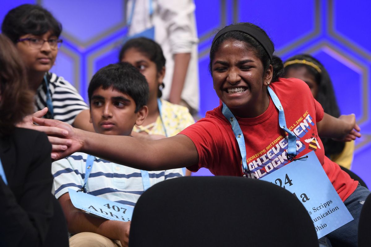 Nilla Rajan, 14, of Chillicothe, Ohio, is congratulated after she correctly spelled her word as she competes in the finals of the Scripps National Spelling Bee in Oxon Hill, Md., Thursday, May 30, 2019. (Susan Walsh / Associated Press)