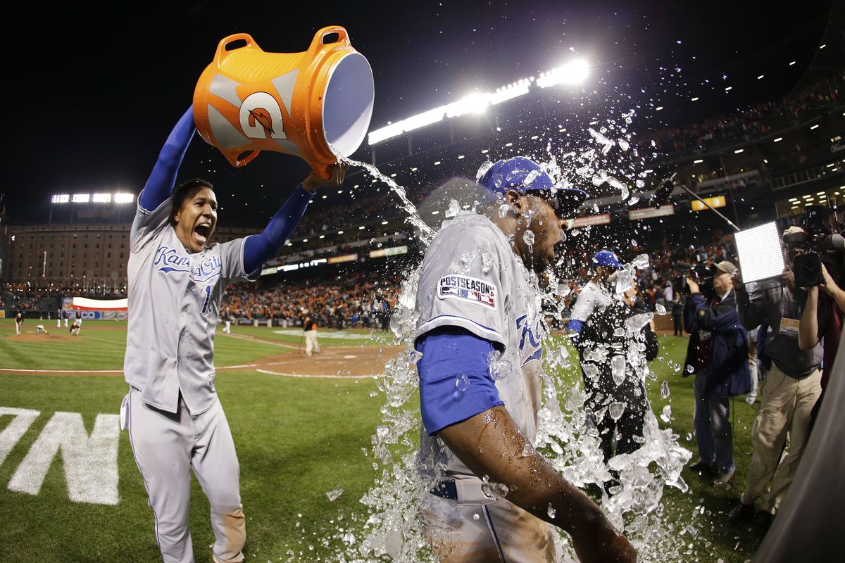 Kansas City’s Lorenzo Cain, right, is showered by Salvador Perez following Game 2 of the American League Championship Series. (Associated Press)