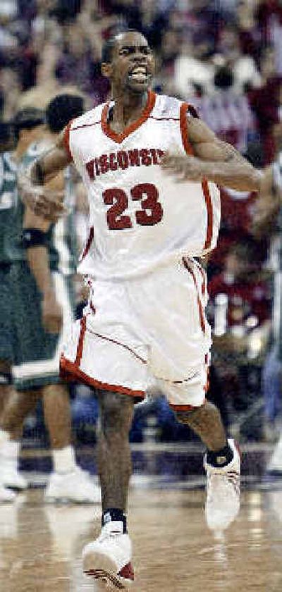 
Badgers' Kam Taylor reacts after scoring the go-ahead basket. 
 (Associated Press / The Spokesman-Review)