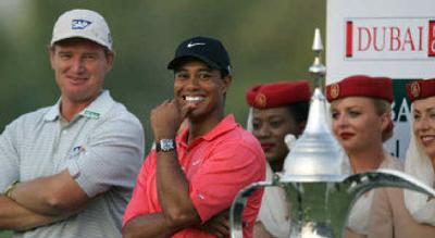 
Both Ernie Els and Tiger Woods smile, but champ has bigger grin. 
 (Associated Press / The Spokesman-Review)