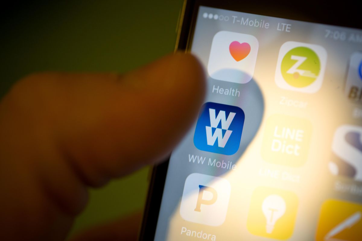 Weight Watchers new name – WW – is displayed on a mobile app. (Michael Nagle / Bloomberg)