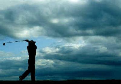 
Thomas Levet of France tees off at the 13th  Saturday during the third round of the 133rd British Open at Royal Troon.
 (Associated Press / The Spokesman-Review)