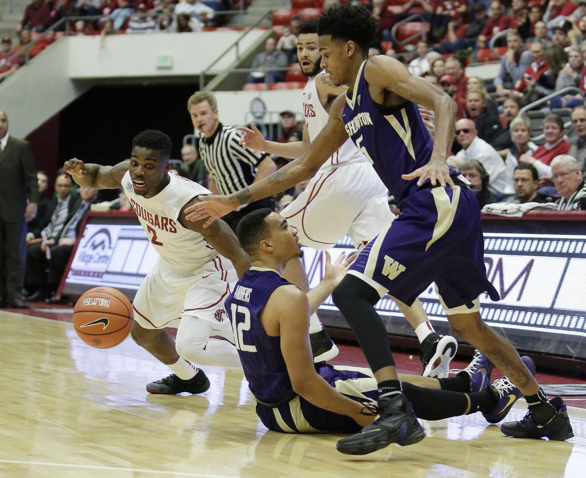 Washington State’s Ike Iroegbu (2) goes after a loose ball against Washington’s Dejounte Murray, right, as Andrew Andrews looks on during the first half of an NCAA college basketball game, Saturday, Jan. 9, 2016, in Pullman. (Young Kwak / Fr159675 Ap)